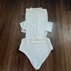 White Body suit. Side cut outs. Lux LA. Size XS